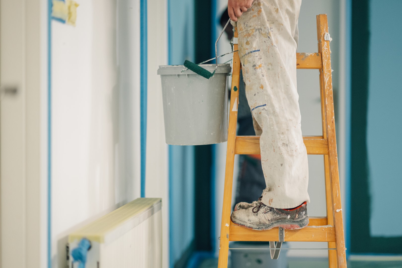 painter-working-on-wooden-ladder-holding-paint-buc-2026-03-09-02-33-48-utc (Large)